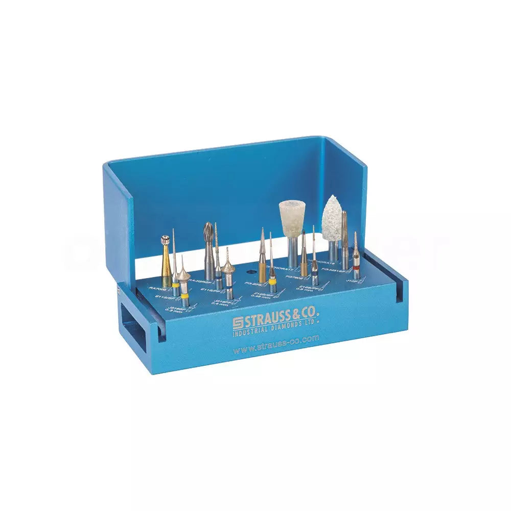 A Strauss & Co. Debonding Kit featuring a blue case with labeled slots containing various carbide burs and orthodontic polishers, specifically designed for safe composite and adhesive removal from enamel.